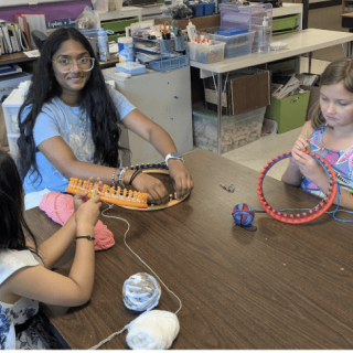 Varnika making hats with campers